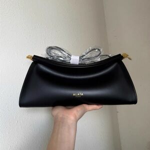 Alaia Black Crossbody Bag with Gold Details